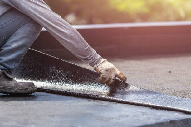Professional Basement Waterproofing technician working in East Rockaway, NY